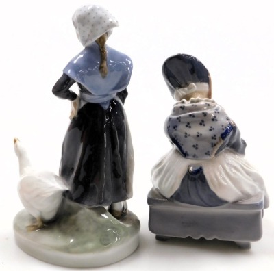 A Royal Copenhagen porcelain figure of a girl with a goose, no. 528, 19.5cm high, printed and painted marks, and a further figure of a girl modelled seated darning, no. 1314, printed and painted marks, 15cm high.(2) - 2