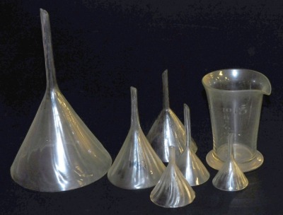 Five Victorian painted cut glass funnels, of spiral fluted form, largest funnel, 26 cm high, together with a cut glass measuring jug, 2floz. (7)