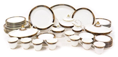 A Royal Doulton porcelain Verona pattern part dinner and tea service, comprising a pair of vegetable tureens and covers, meat platter, sauce boat on stand, ten dinner and dessert plates, eight soup plates, nine side plates, four fruit bowls, teapot, bread