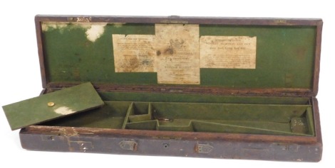 A Victorian Westley Richards and Company brown leather bound oak gun case, with a green baize fitted interior, bears labels to lid, with key, 82cm wide.