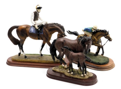 An Originalities equestrian figure of The Racing Game, modelled by John Skeatin, number 7N/201, for Minster Gift Ware, 31cm wide, Leonardo Collection figure of The Winner, 26cm wide, and a further figure group of a brown horse and foal, 22cm wide. (3)