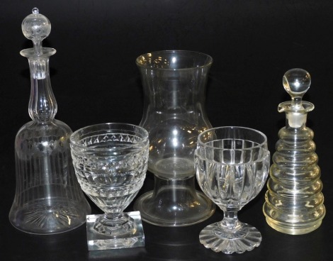 Two Victorian cut glass rummers, an etched glass bell shaped decanter and stopper, cut glass celery vase, with a folded foot, and a spirit decanter and stopper. (5)