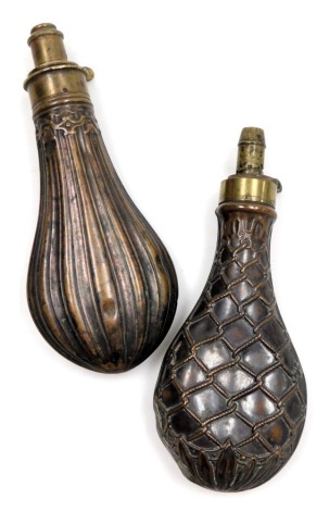 Two 19thC copper powder flasks, of pear form, cast in a foliate and net design, 20.5cm high, and a further copper powder flask, of pear form, with fluted and embossed decoration, 20cm high. (2)