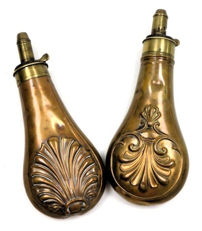 A 19thC G & JW Hawksley copper powder flask, of pear form, embossed with a leaf and scroll design, impressed marks, 20.5cm high, and a further copper powder flask, similarly decorated, 20cm high. (2)