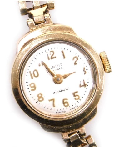 A Summit lady's 9ct gold wristwatch, silvered dial bearing Arabic numerals, seventeen jewelled movement, on a 9ct gold gate link bracelet strap, 15.1g all in.