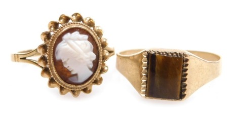 A 9ct gold lady's tiger's eye set signet ring, size R, together with a 9ct gold and cameo ring, bust portrait of a lady, size N, 4.9g. (2)