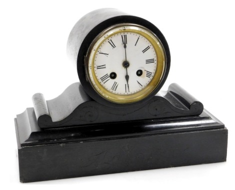 A Victorian slate mantel clock, circular enamel dial bearing Roman numerals, eight day movement with bell strike, the case of barrel and scroll form, raised on a rectangular plinth base, with pendulum, no key, 21cm high, 31cm wide.