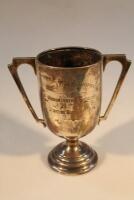 A George V silver two-handled prize cup of Art Deco design inscribed 'The O'Dell Trophy Junior Instr