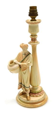 A Royal Worcester blush porcelain figural table lamp, c1897, the baluster lamp column fronted by an Indian gentleman holding a pot, printed to base "Cricklite", model no. 1890, printed marks, 34.5cm high.