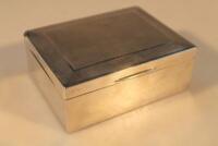 A George V silver cigarette box with engine turned and Greek key decorated lid