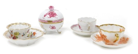 An Herend porcelain Pink Rose pattern circular box and cover, together with a coffee cup and saucer, a Helena Wolfsohn porcelain coffee cup and saucer painted with three floral sprays, and a Arabia porcelain coffee cup and saucer, decorated with flowers. 