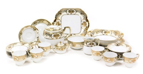 A Noritake porcelain part tea service, gilt decorated with flowers, within a cream ground, comprising teapot, cream jug, sugar bowl, sucrier, a pair of bread plates, six tea cups, saucers and plates, together with a twin handled fruit bowl.