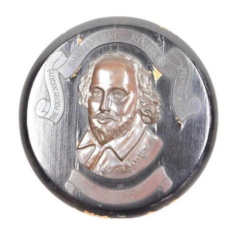 A Poetry Society's Shakespeare Recitals Premier Award plaque, cast with the profile of The Bard, above a banner engraved to D.Mumford, 21-11-40, 20cm wide.