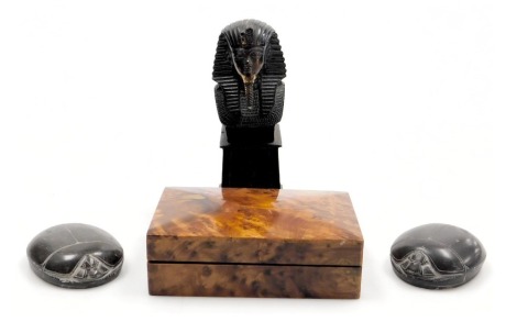 A thuya wood box, 15cm x 10cm, a pair of hardstone scarab paperweights, and a patinated copper bust of a pharaoh on a plinth, 17cm high. (4)