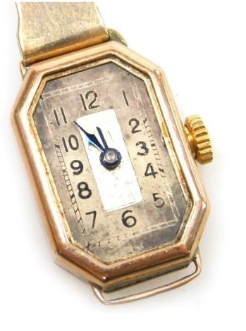 A mid century lady's 9ct rose gold cased wristwatch, octagonal silvered dial bearing Arabic numerals, on a gold bracelet strap, 11.9g all in.