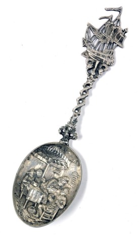 A late 19thC Dutch silver spoon, second standard purity, with a galleon terminal and serpent entwined shaft, the bowl embossed with a man having a tooth extracted, 1.535oz.