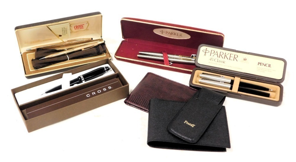 Parker and Cross pen sets boxed together with a Piaget wallet