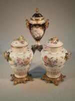A pair of 19thC German porcelain vases decorated in the Meissen style (AF)