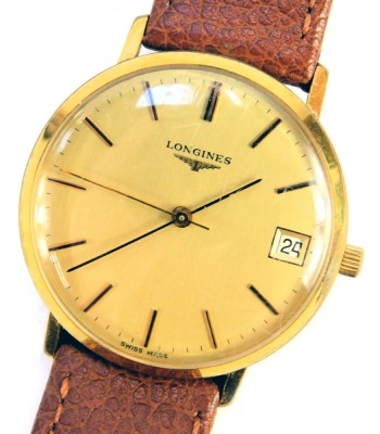 A Longines gentleman's wristwatch, the circular gold coloured dial bearing baton pointers and date marker, in gold coloured casing with stainless steel back numbered 19282452, on a Condor brown leather strap, face diameter 3.3cm.