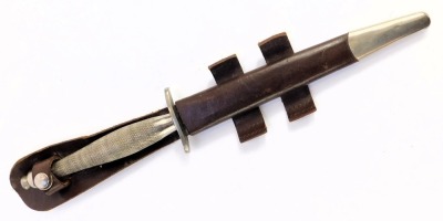 A Fairbairn-Sykes fighting knife, with cross hatched handle, the blade marked Wilkinson sword, in leather scabbard, length of blade 16.5cm, 29.5cm long overall. - 4