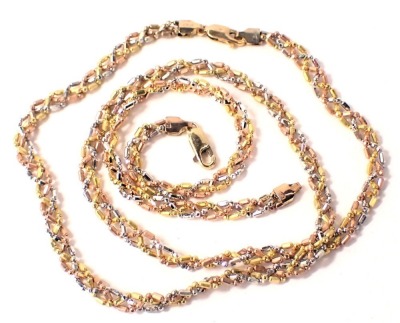 A 9ct gold fancy link necklace and bracelet set, of bi-colour twist design with silver, gold and rose gold decoration, the necklace 44cm long, the bracelet 18cm long, 16.5g all in.