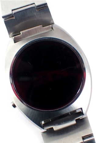 A Pierre Bideau LED men's 1970s wristwatch, with LED dial and red LED clock face, on a stainless steel strap, unmarked, the dial 3cm diameter.