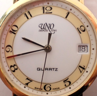 An Uno 9ct gold cased wristwatch, with a cream and white numeric dial, and date aperture, on a plated bracelet, the dial, 3cm diameter, 55.1g all in. - 2