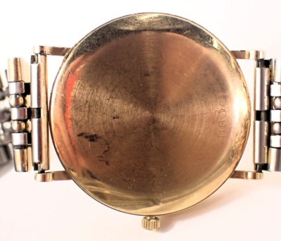 An Uno 9ct gold cased wristwatch, with a cream and white numeric dial, and date aperture, on a plated bracelet, the dial, 3cm diameter, 55.1g all in. - 3