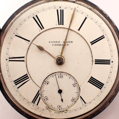 A Victorian silver cased pocket watch, with a white enamel Roman numeric dial, with gold hands and seconds dial, key wind, Chester 1891, on a white metal watch chain, unmarked, with a silver shield crest with blue enamelled design, 171g all in. - 2