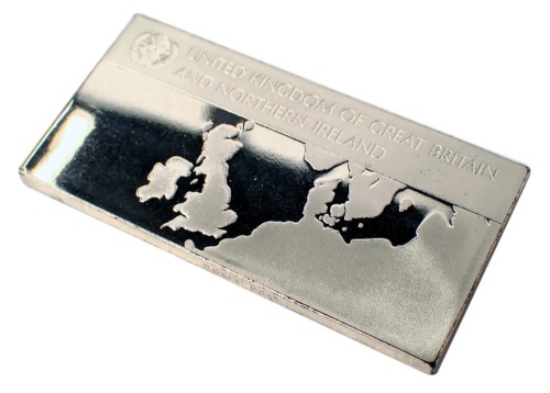 A silver ingot, inscribed United Kingdom of Great Britain and Northern Ireland, with map to once side and flag to reverse, 38.7g.