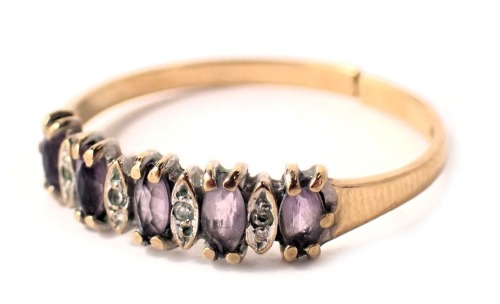 A 9ct gold dress ring, set with amethyst and cubic zirconia in claw setting, on a yellow metal band, 1.4g, cut. (AF)