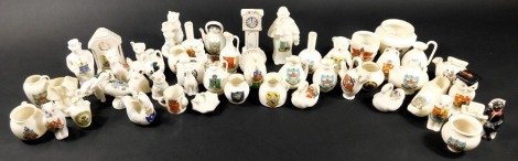 A collection of various crested china ornaments, to include Arcadian, W H Goss, Grafton, and others, including animals. birds, clocks, and ancient pots. (50)