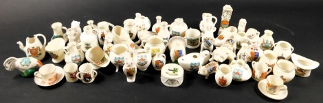 A collection of various crested china ornaments, to include Pearl Arms China, Carlton, W H Goss, and others, including Vote for Sloper ...., Bulldog, some animals, and ancient pots. (50)