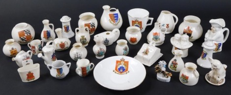 A collection of various crested china ornaments, to include a match striker (Mundesley), Toby jug, ancient pots, etc. (32)