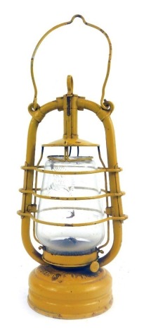 A Feuerhand yellow painted paraffin lamp, number 201, 40cm high.