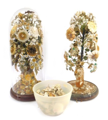 Two Victorian shell encrusted displays, modelled as floral bouquets, one contained in a glass dome, 50cm high, the other AF and lacking dome.