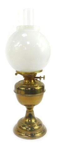 A late 19th/early 20thC Duplex brass oil lamp, with white milk glass shade, with chimney, 53.5cm high overall.