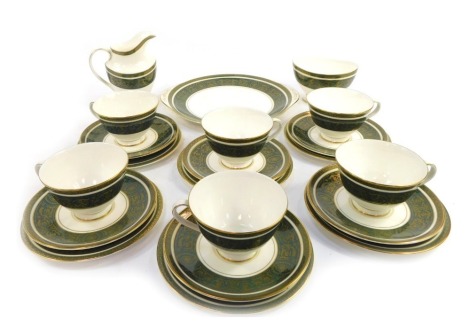 A Royal Doulton porcelain part tea service decorated in the Vanborough pattern, comprising six teacups and saucers, six side plates, cake plate, serving dish, sugar bowl and milk jug.