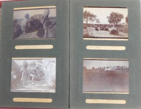 A photograph album containing early 20thC photographs in India, to include figures with guns before fallen leopard, figures in regimental uniform, street scenes, etc., possibly associated to the Northamptonshire 48th Regiment.