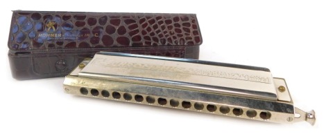 An M Hohner 64 chromonica, in simulated crocodile case.