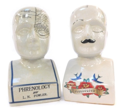 Two pottery phrenology heads, one decorated with floral and bird motifs, 19cm high, the other by LM Fowler, 29cm high.