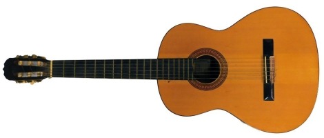 A Hohner acoustic guitar, model number HC-06.