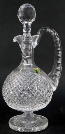 A Waterford crystal cut glass claret decanter, with stopper, 32cm high, with certificate numbered 182325.