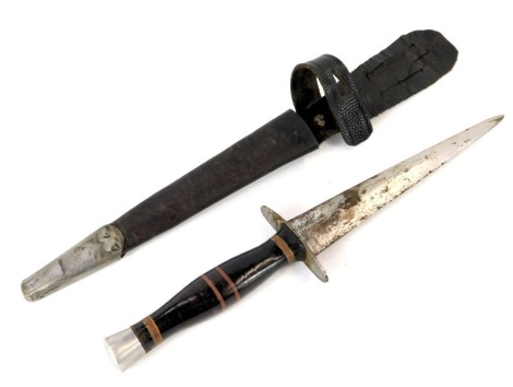 A fighting knife, with leather bound grip and alloy pommel, with leather sheath.