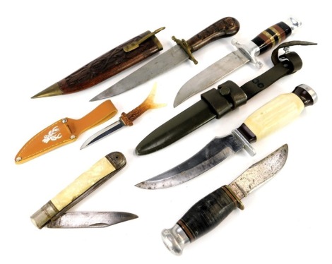 Sheath knives and skinning knife, including a sheath knife with composite handle and alloy pommel and hilt, in Army metal sheath, two sheath knives both lacking sheaths, one stamped Milbro Campa, Indian knife with sheath, folding penknife by Richards of S