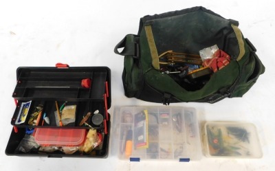 A group of fishing tackle, to include net, canvas bag, fishing rods, etc.  (a quantity)