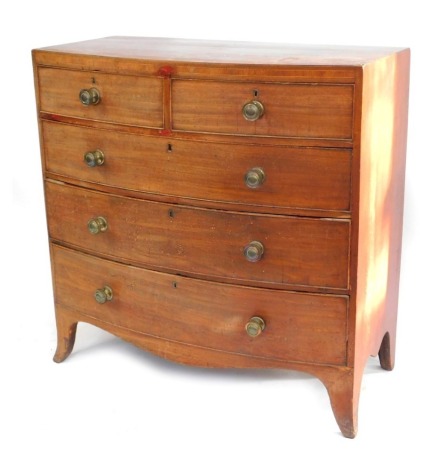 An early 19thC bow fronted mahogany chest, with two short and three long graduated drawers, with later brass handles on splayed legs, 106cm, 106cm wide, 52cm deep.