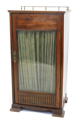 A late Victorian mahogany music cabinet, with velvet covered shelves, 90cm high, 48cm wide.