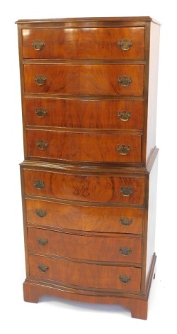 A Georgian style flame mahogany serpentine chest on chest, 58cm wide.