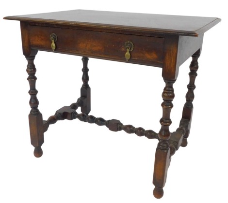 An Edwardian oak side table, in 17thC style with bobbin turned supports, 81cm wide.